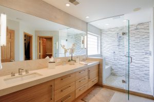 Contemporary bathroom with two (2) sinks and quarter-sawn oak cabinets with a large walk-in shower