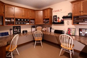 Office or craft room with oak cabinets and laminate countertops