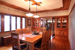 Dining room with built-in black walnut cabinets and wood detailing
