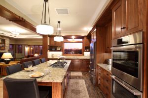 Kitchen cabinets in black walnut with large island for seating