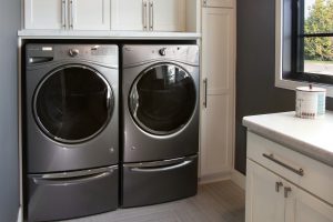 Washer and dryer with custom cabinets painted white