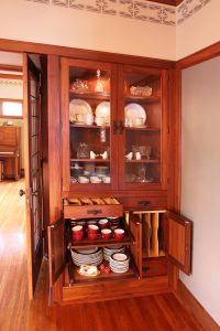 Roll-out shelves, tray dividers and silverware drawers at built in china cabinet