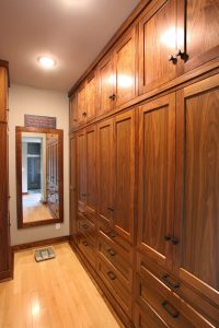 Organization Walk-in Closet with black walnut cabinetry