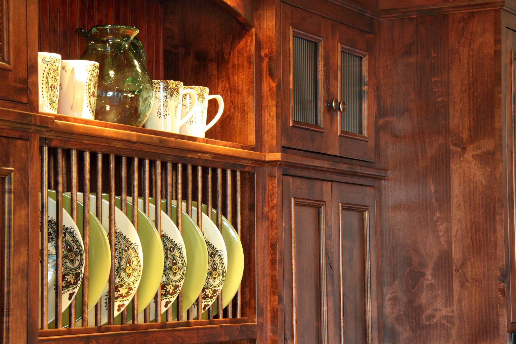 Close up of kitchen cabinets with plate divider and shelf