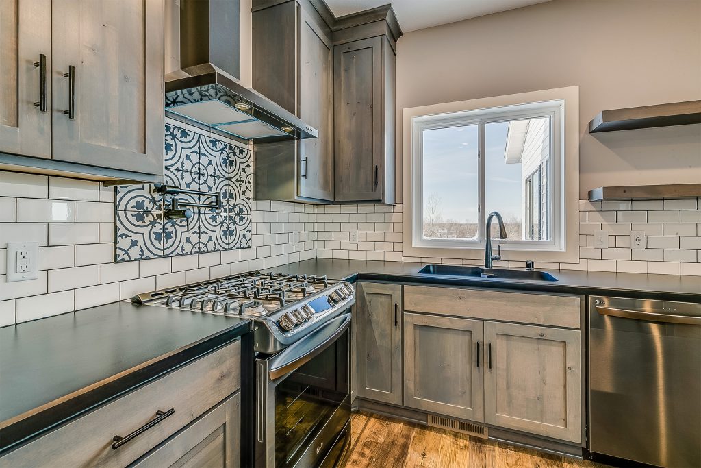 Kitchen with stained knotty alder cabinets