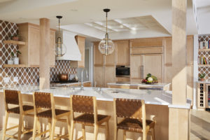 Kitchen with maple cabinets and peninsula seating